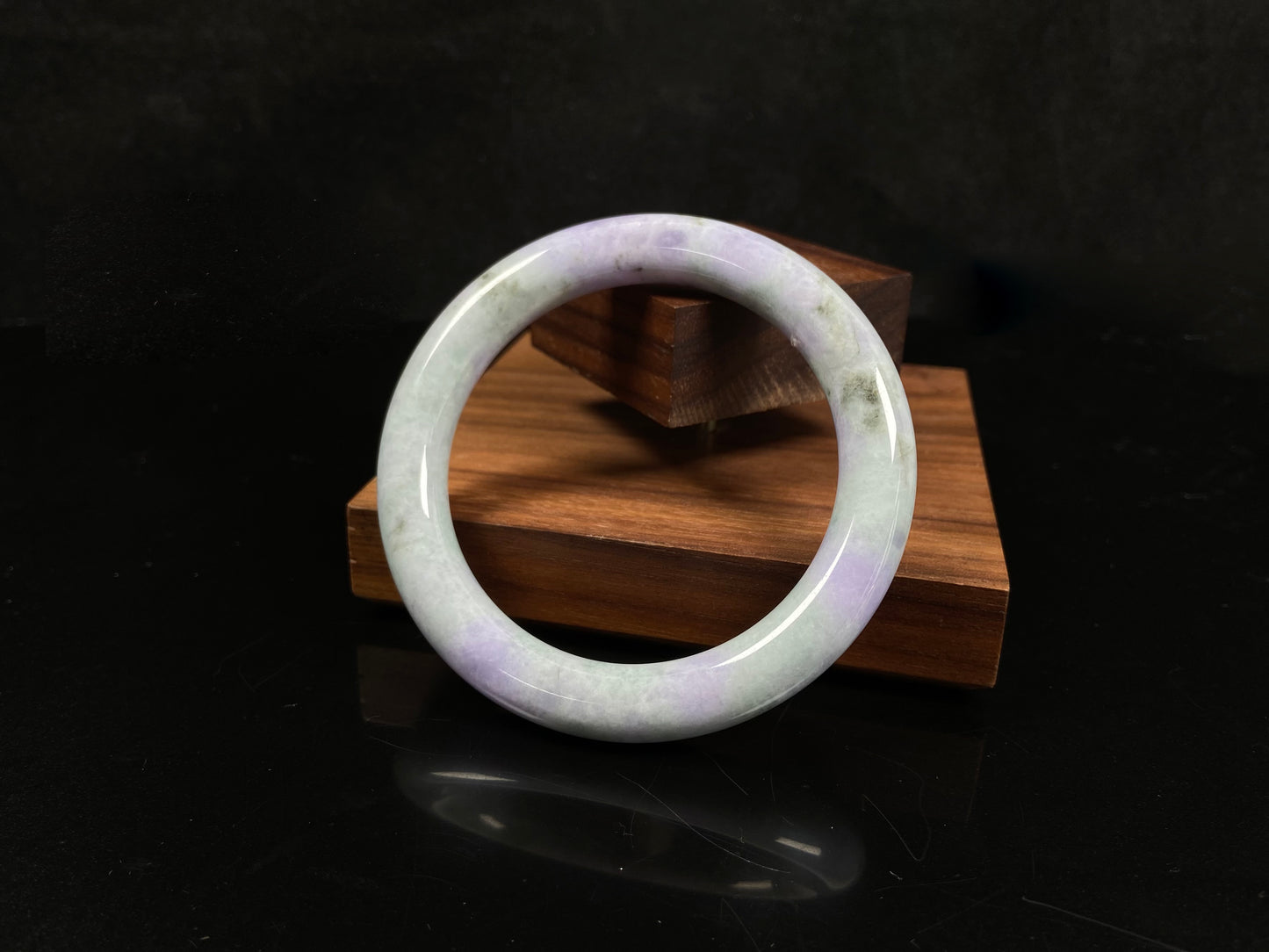 A intermingled green and lavender purple jadeite bangle.