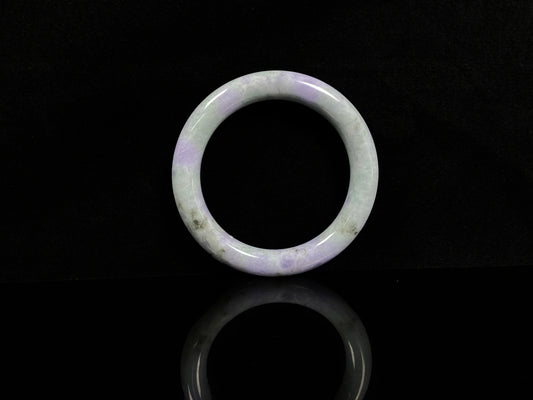 A intermingled green and lavender purple jadeite bangle.