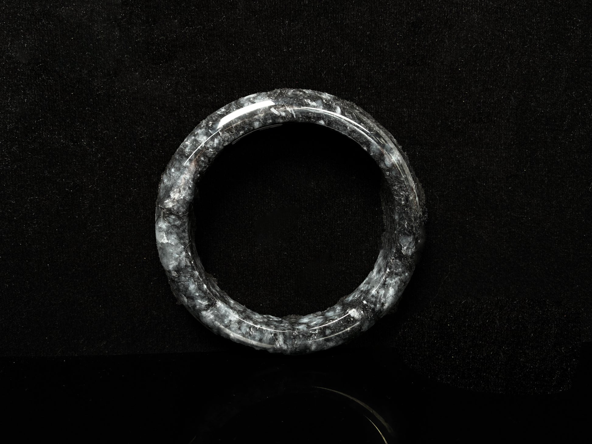A white black jadeite bangle.