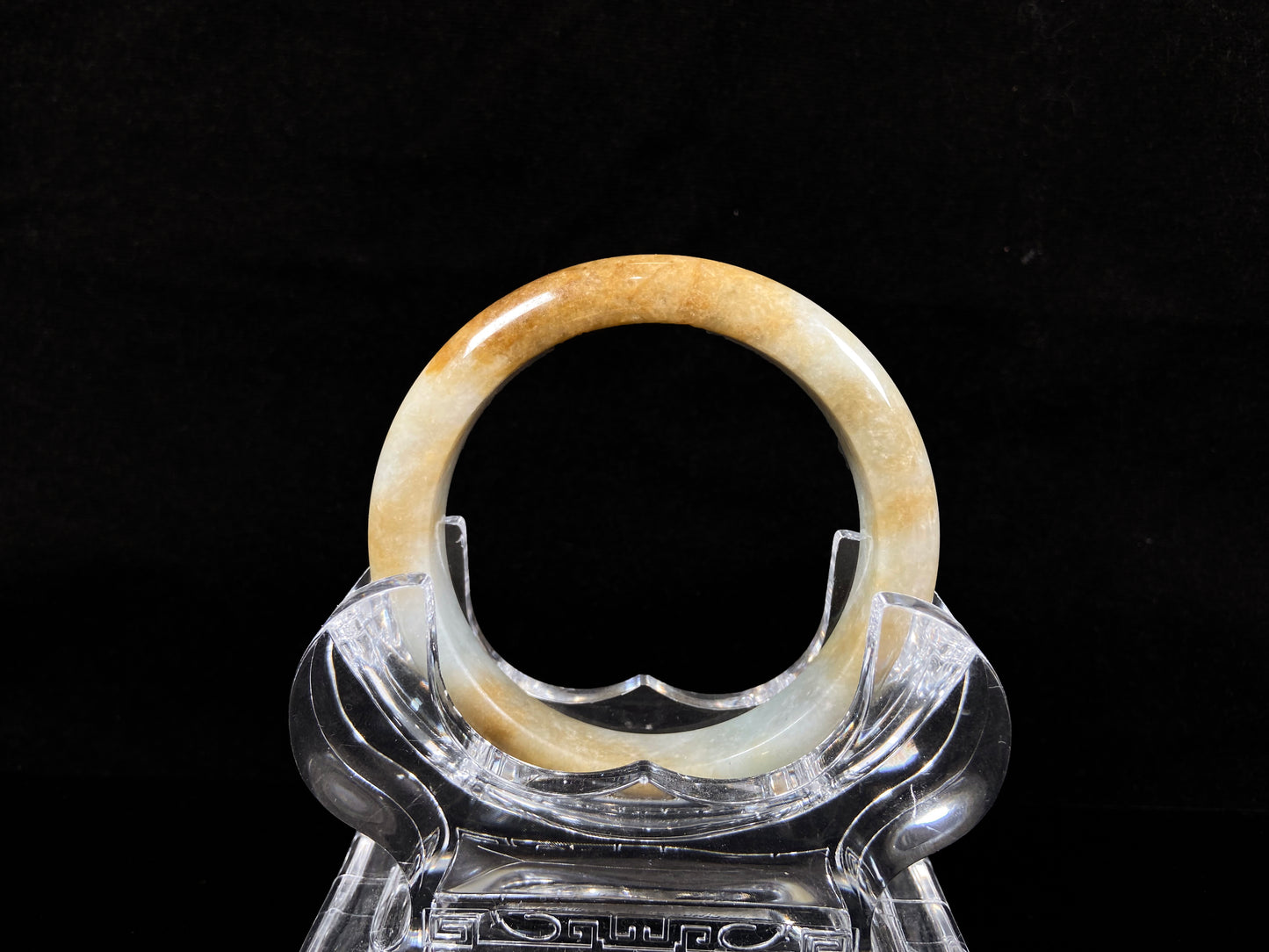 A honeyed amber veil jadeite bangle.