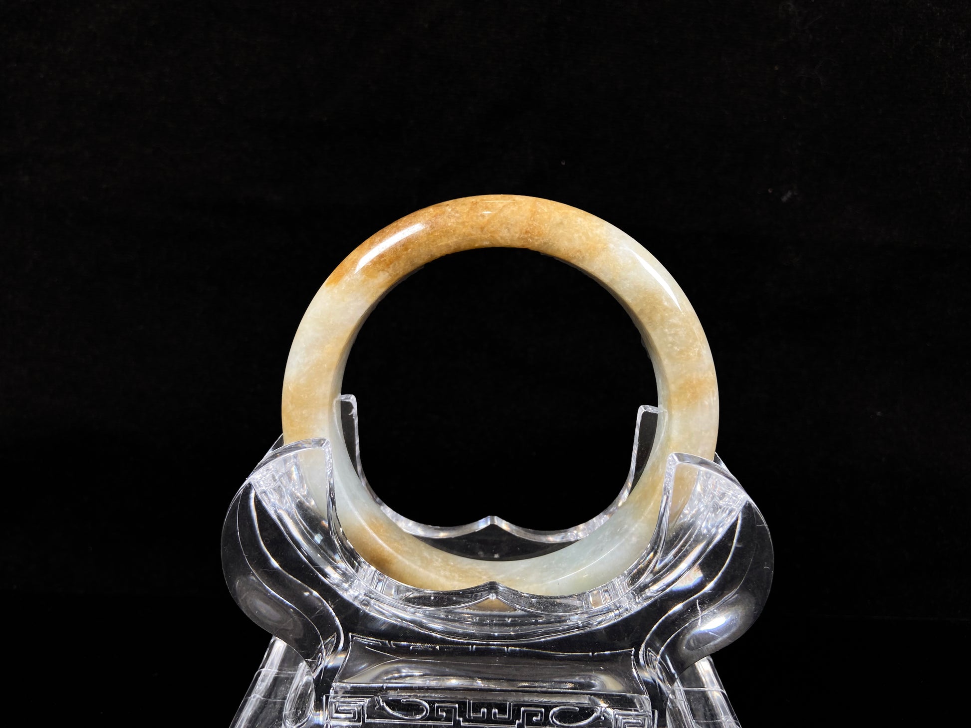 A honeyed amber veil jadeite bangle.