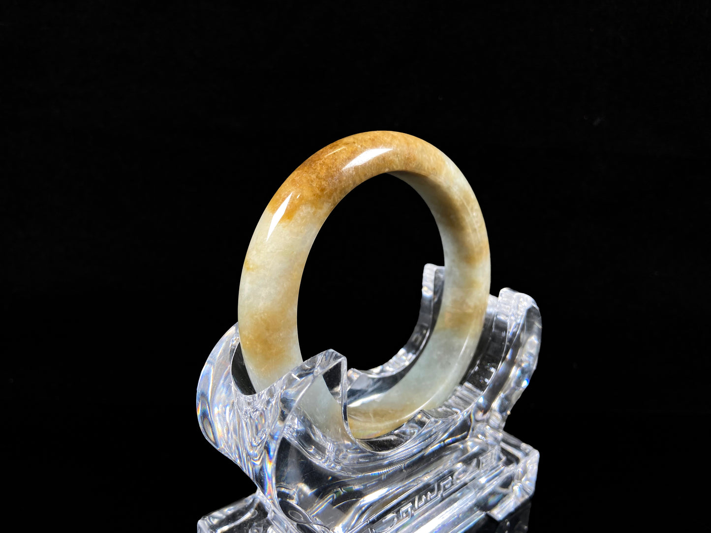 A honeyed amber veil jadeite bangle.