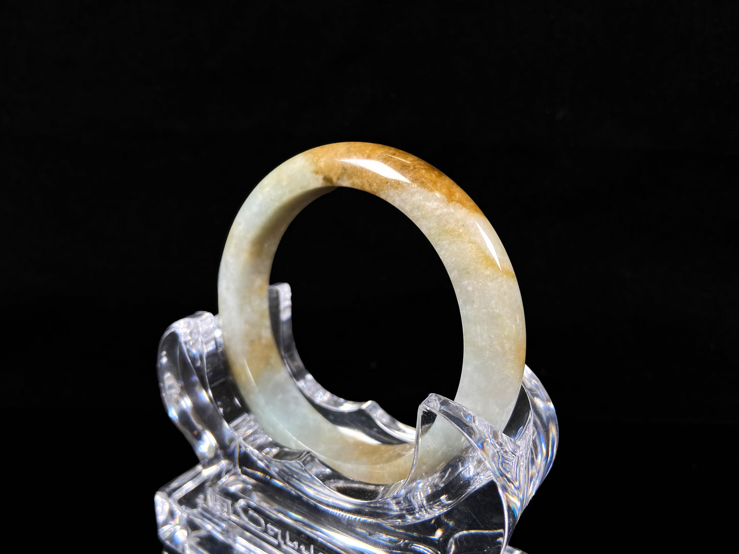 A honeyed amber veil jadeite bangle.