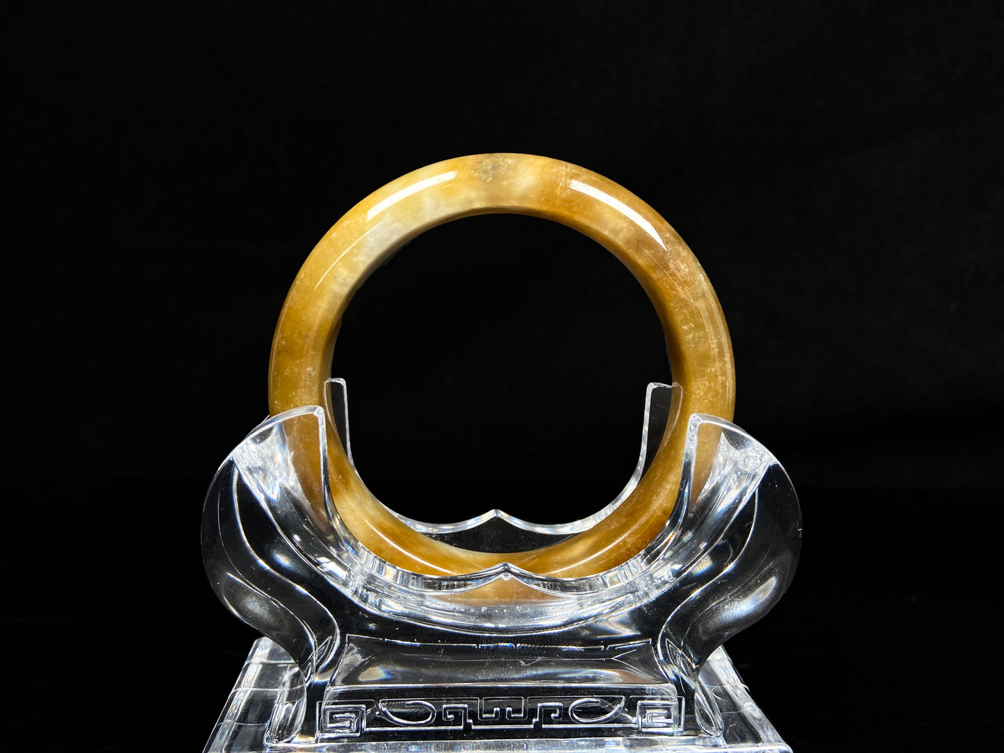 A ambered wisp luster jadeite bangle.