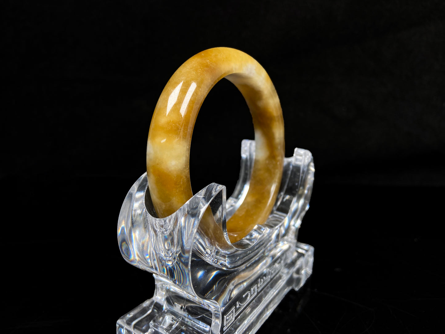 A ambered wisp luster jadeite bangle.