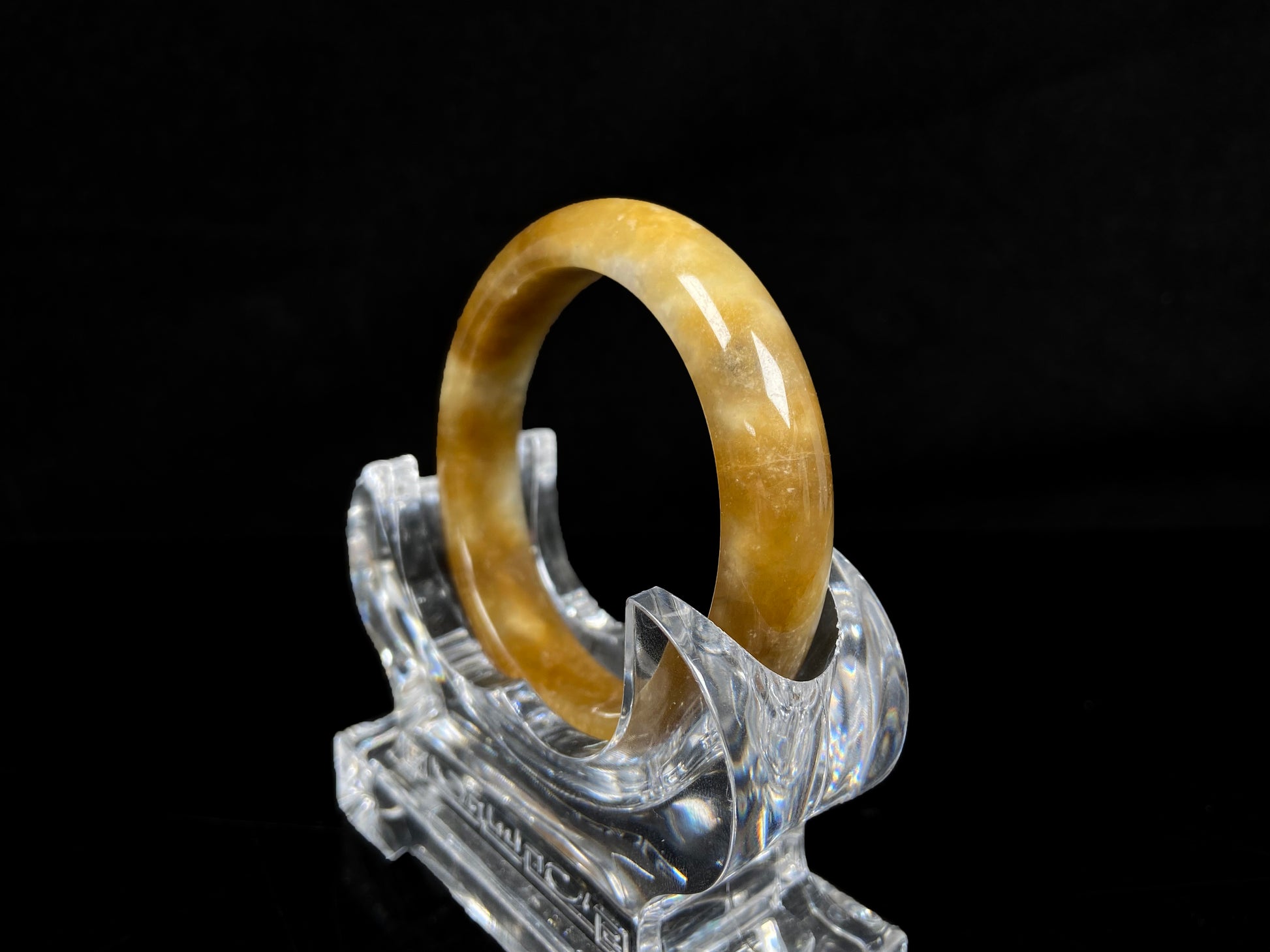 A ambered wisp luster jadeite bangle.