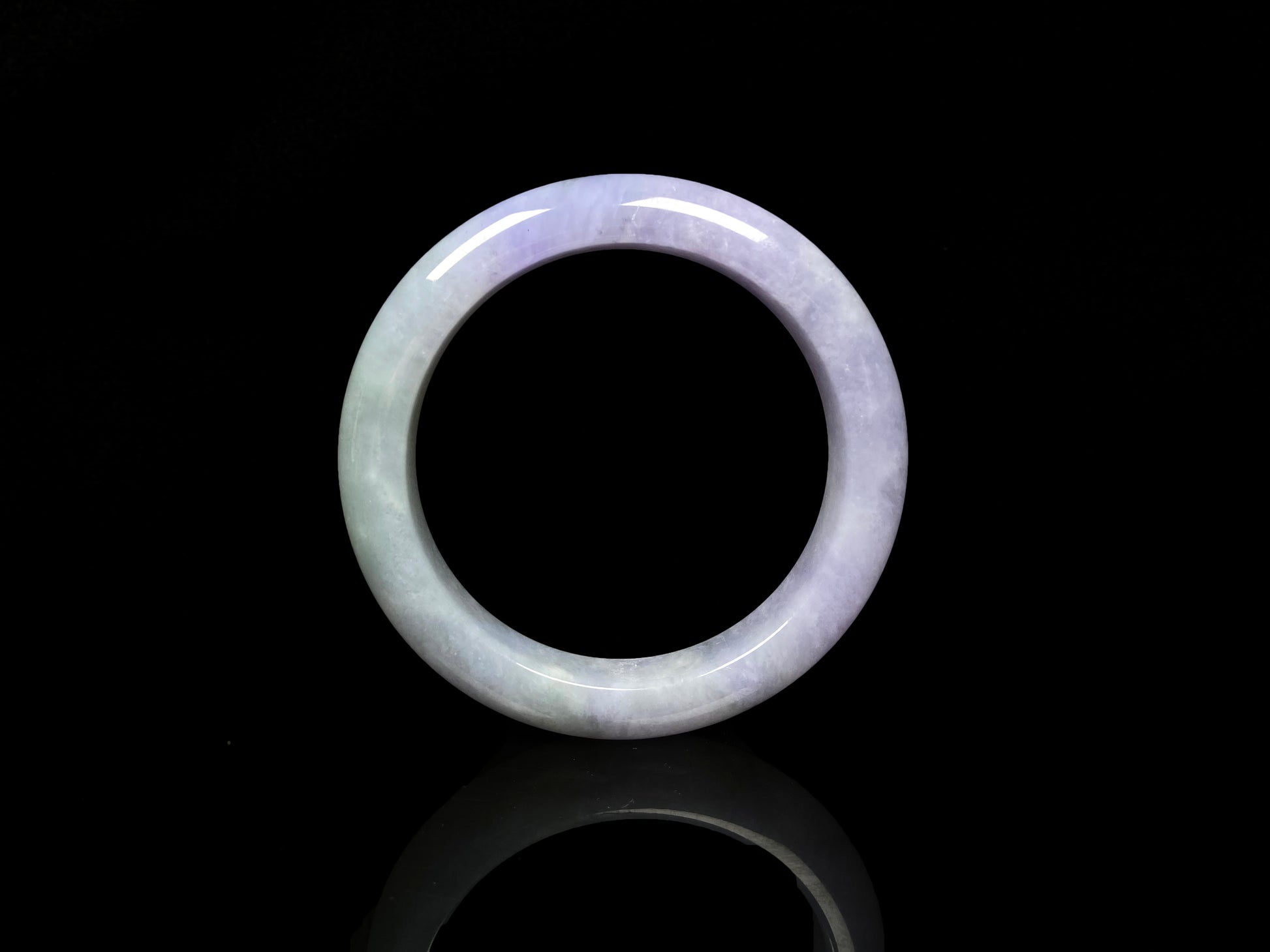 A split lavender green jadeite bangle.