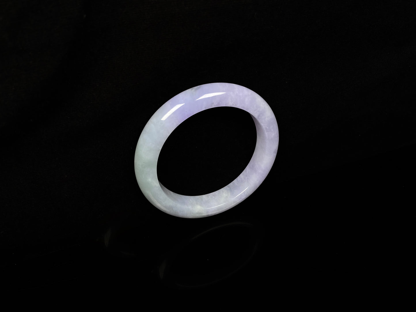 A split lavender green jadeite bangle.
