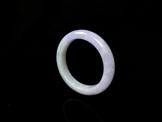 A split lavender green jadeite bangle.