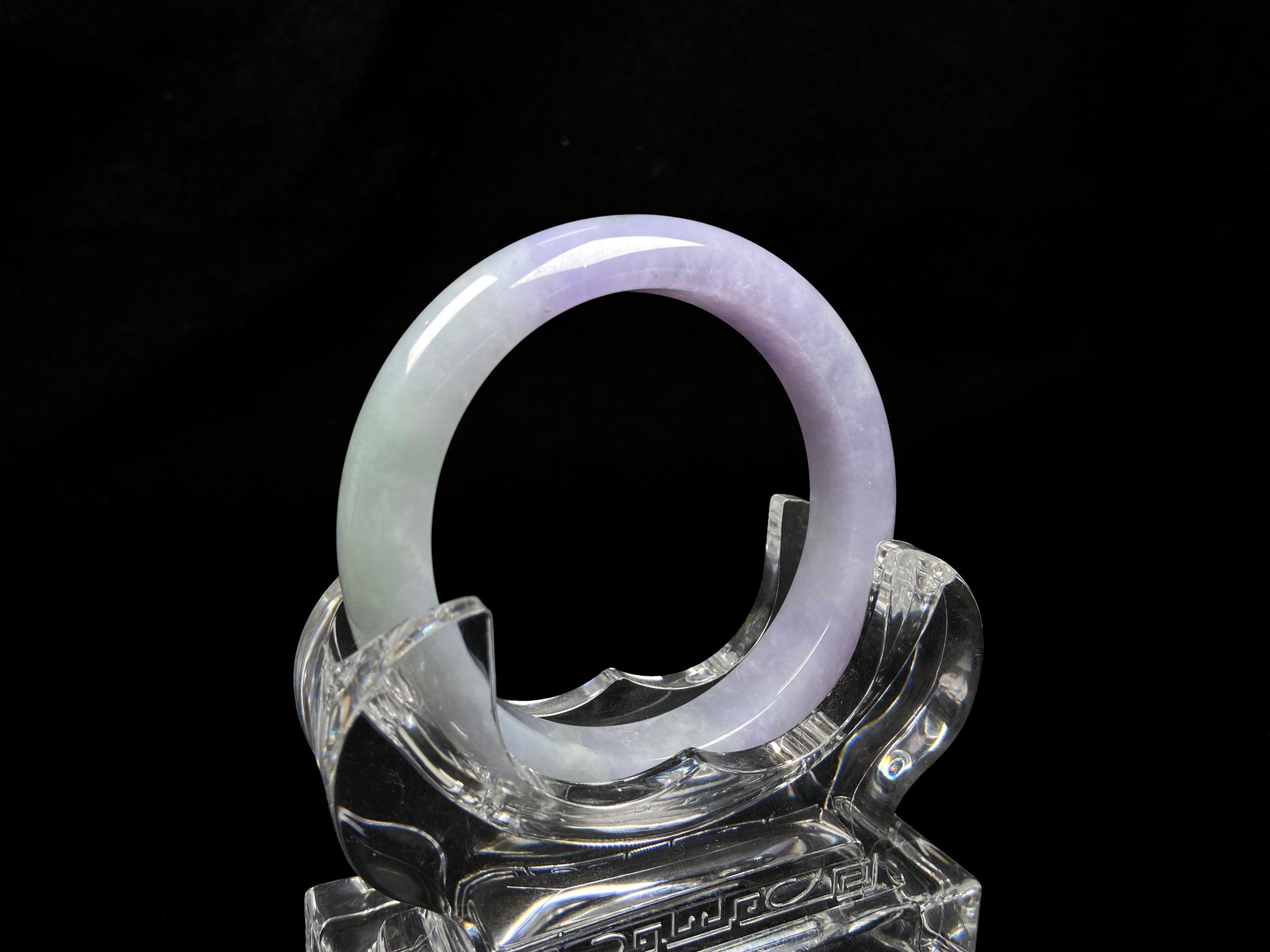 A split lavender green jadeite bangle.