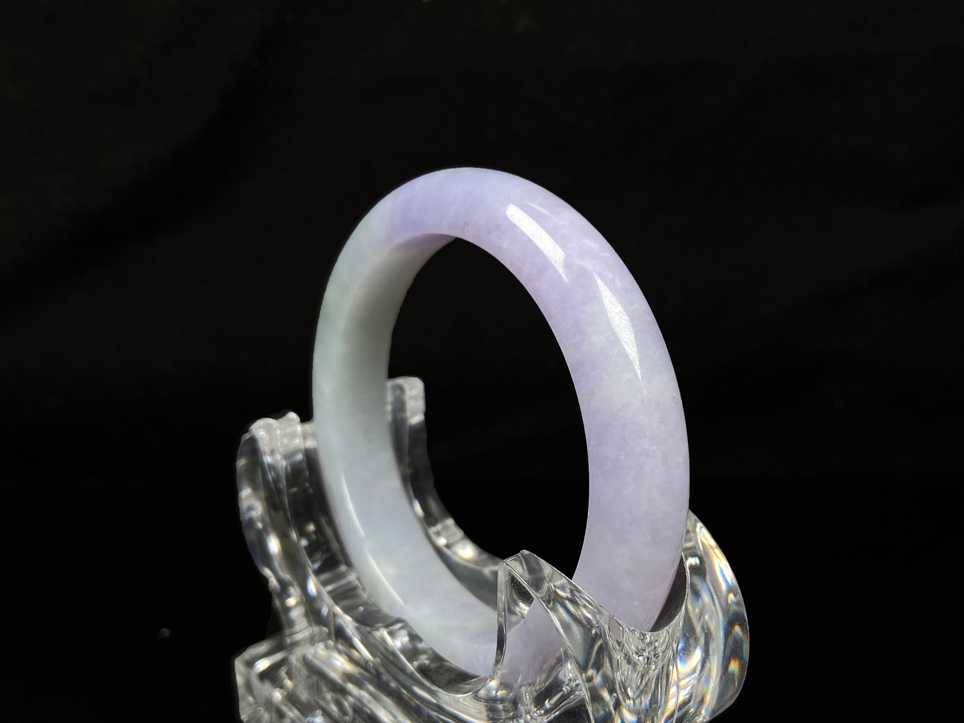 A split lavender green jadeite bangle.