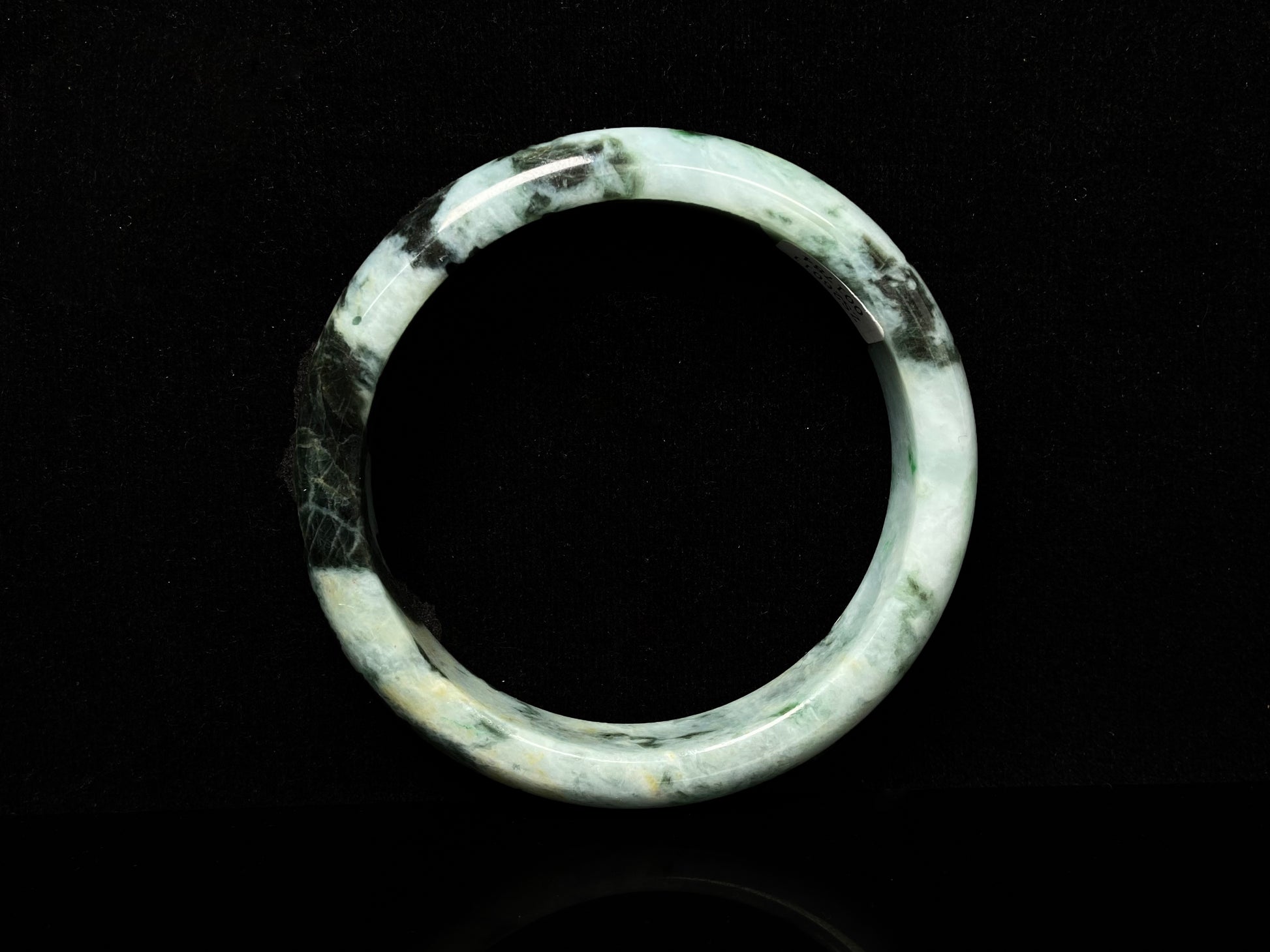 A white black jadeite bangle.