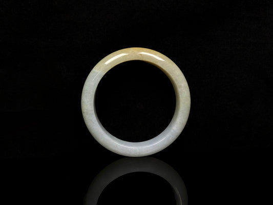 A creamy gold veil jadeite bangle.