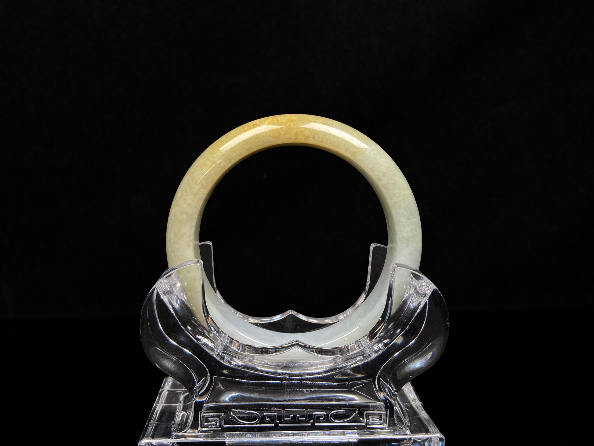A creamy gold veil jadeite bangle.
