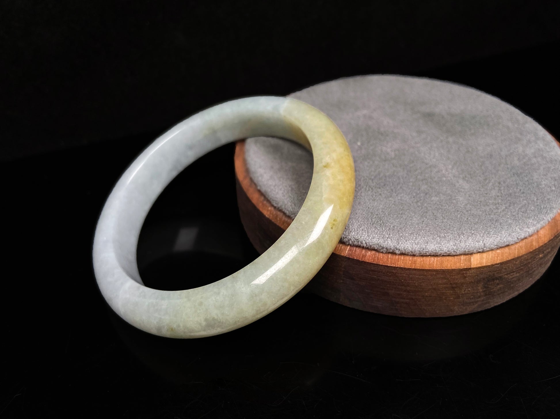A creamy gold veil jadeite bangle.