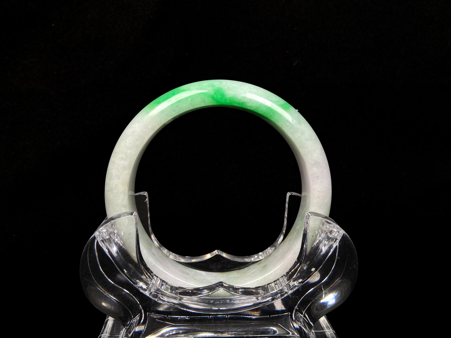 A bright green cloud white jadeite bangle.