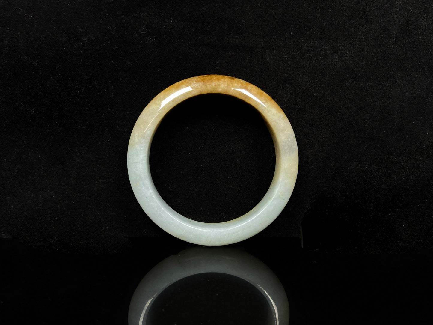 A golden dust sprinkled gently jadeite bangle.