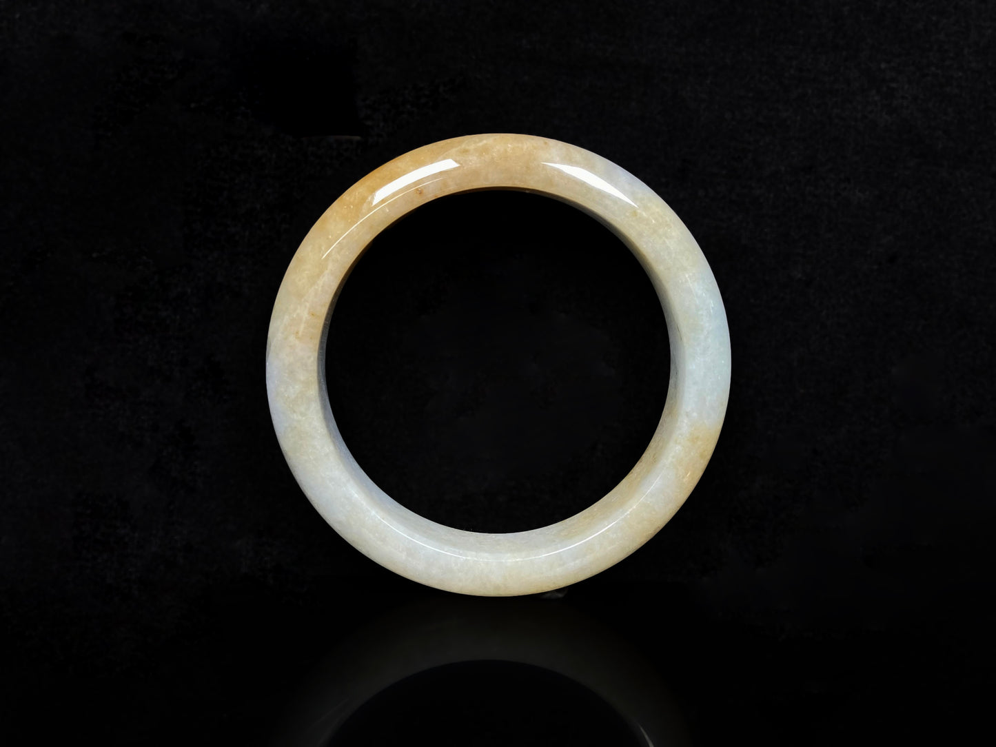 A golden dust sprinkled gently jadeite bangle.
