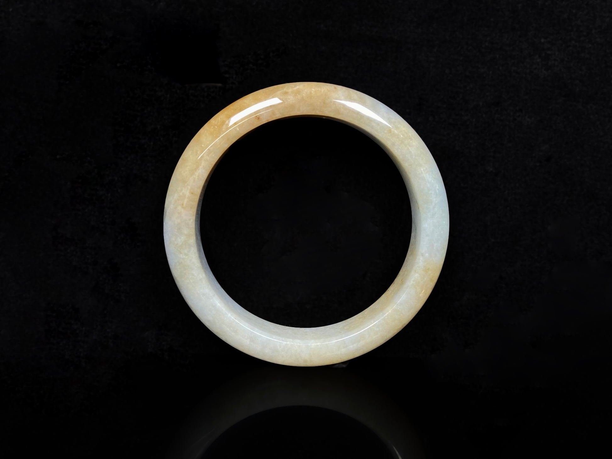 A golden dust sprinkled gently jadeite bangle.