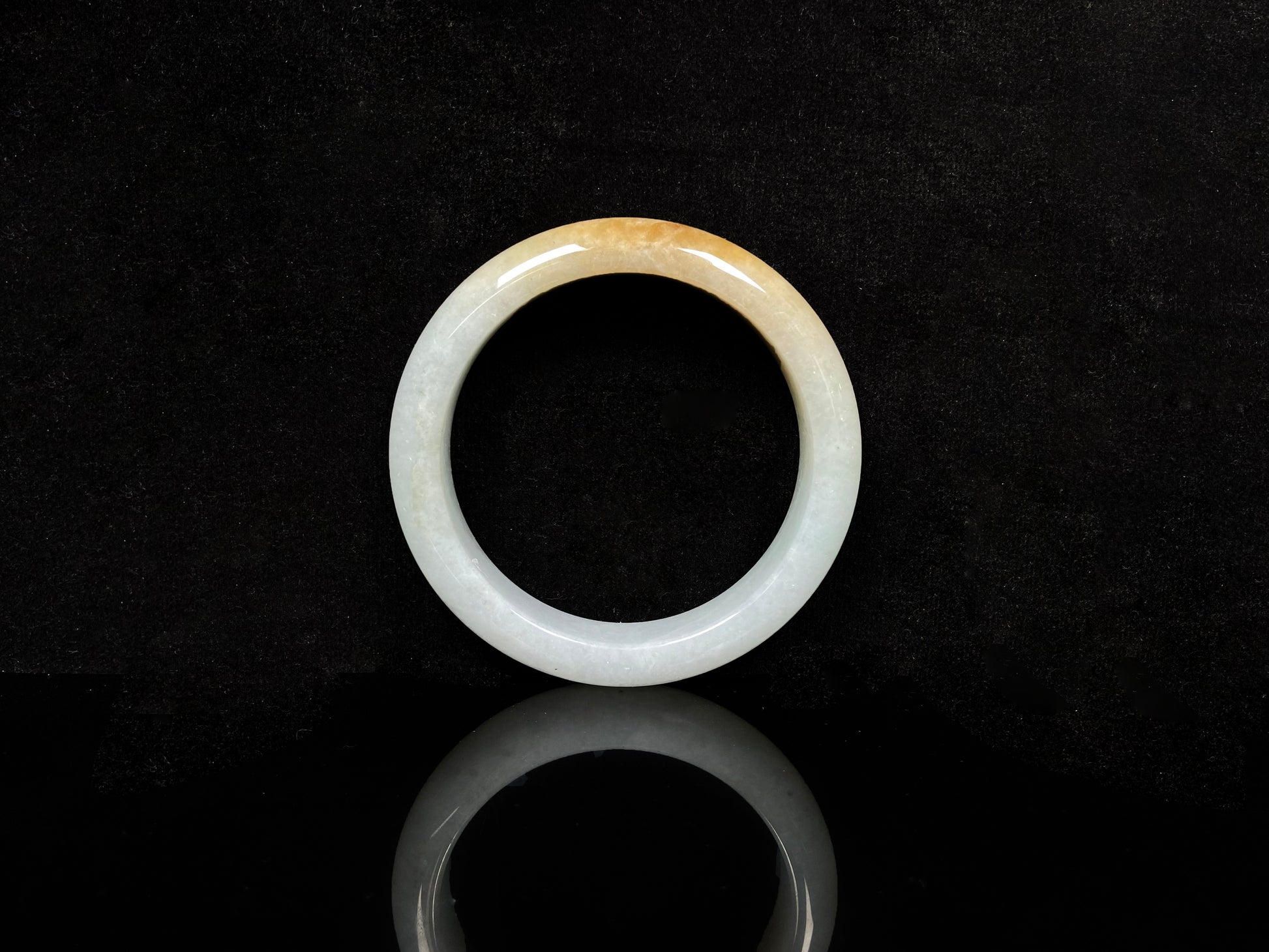 A golden dust sprinkled gently jadeite bangle.