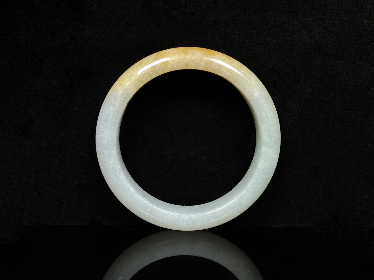 A golden dust sprinkled gently jadeite bangle.