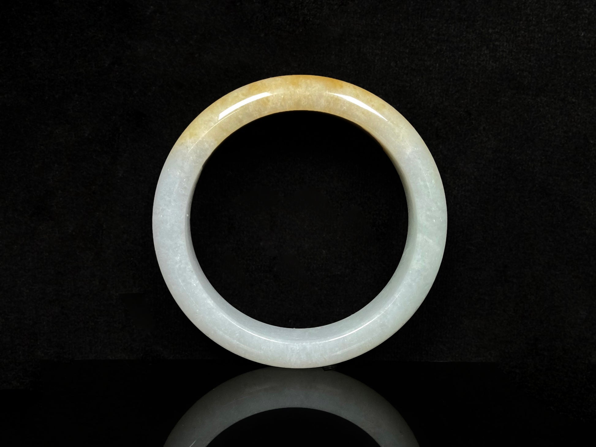 A golden dust sprinkled gently jadeite bangle.