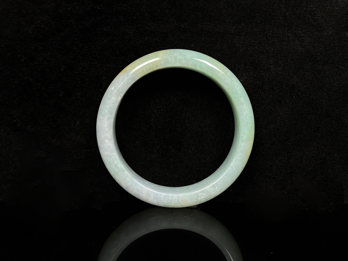 A golden dust sprinkled gently jadeite bangle.