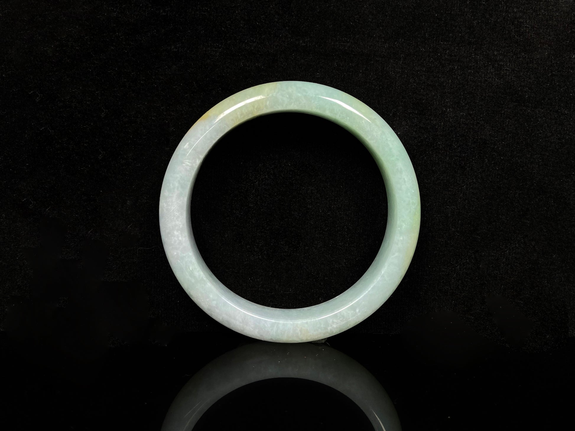 A golden dust sprinkled gently jadeite bangle.