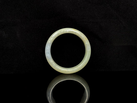 A golden glow spill jadeite bangle.
