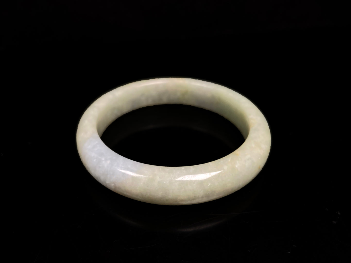 A golden glow spill jadeite bangle.