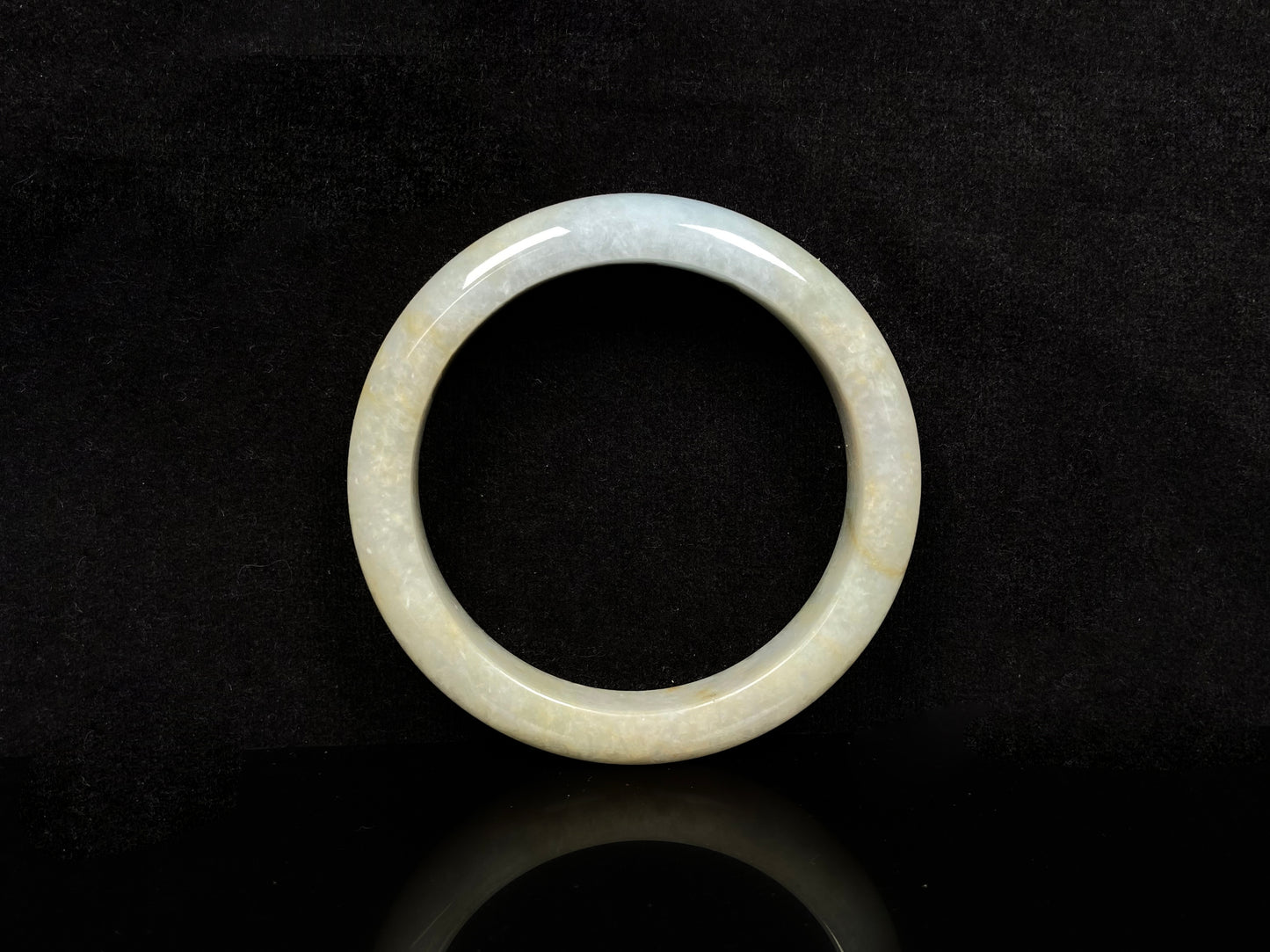 A golden dust sprinkled gently jadeite bangle.