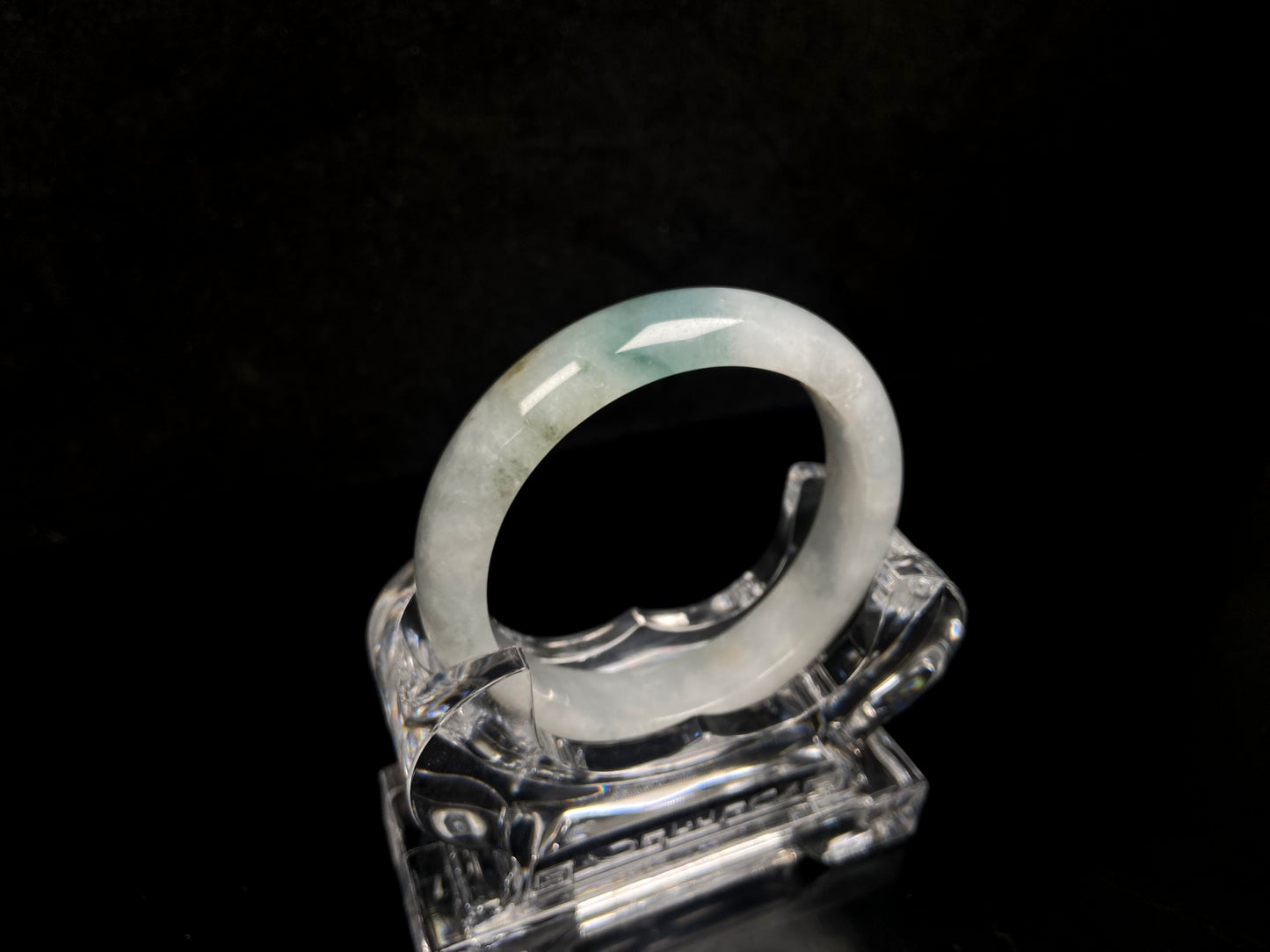 A pale mist azure jadeite bangle.