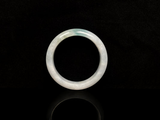 A pale mist azure jadeite bangle.