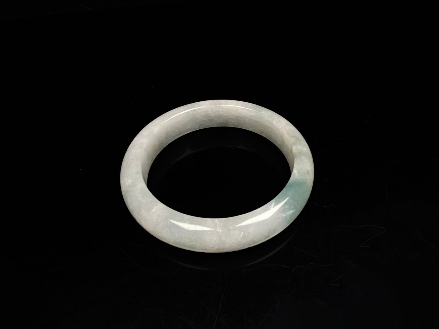A pale mist azure jadeite bangle.