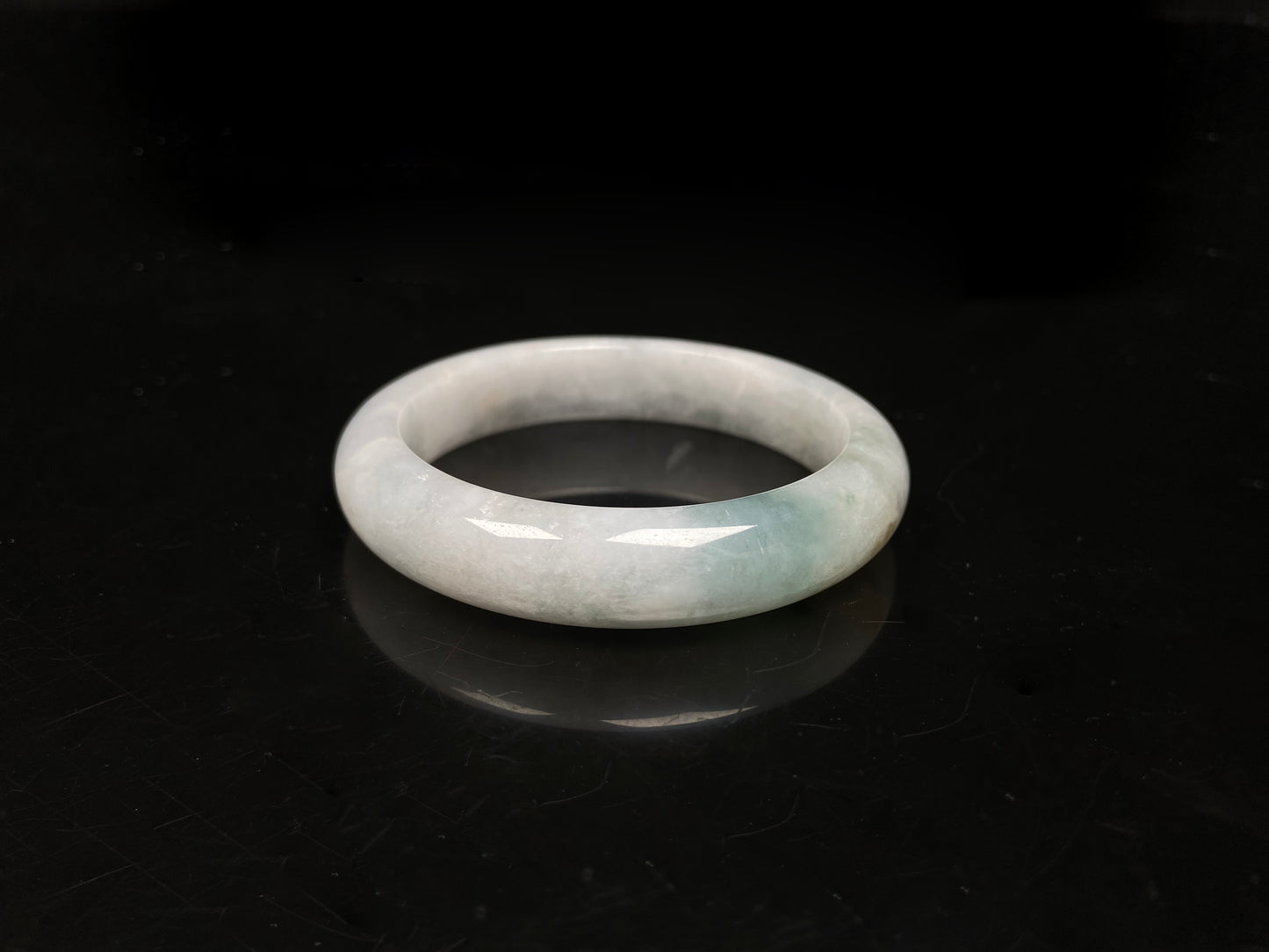 A pale mist azure jadeite bangle.
