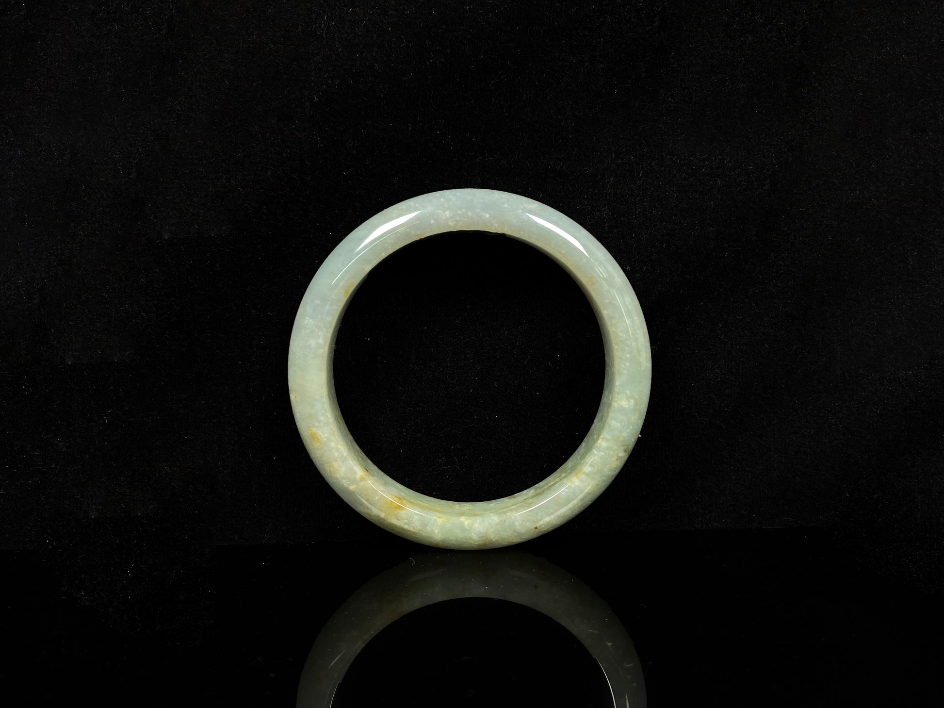 A willow bud green glow jadeite bangle.