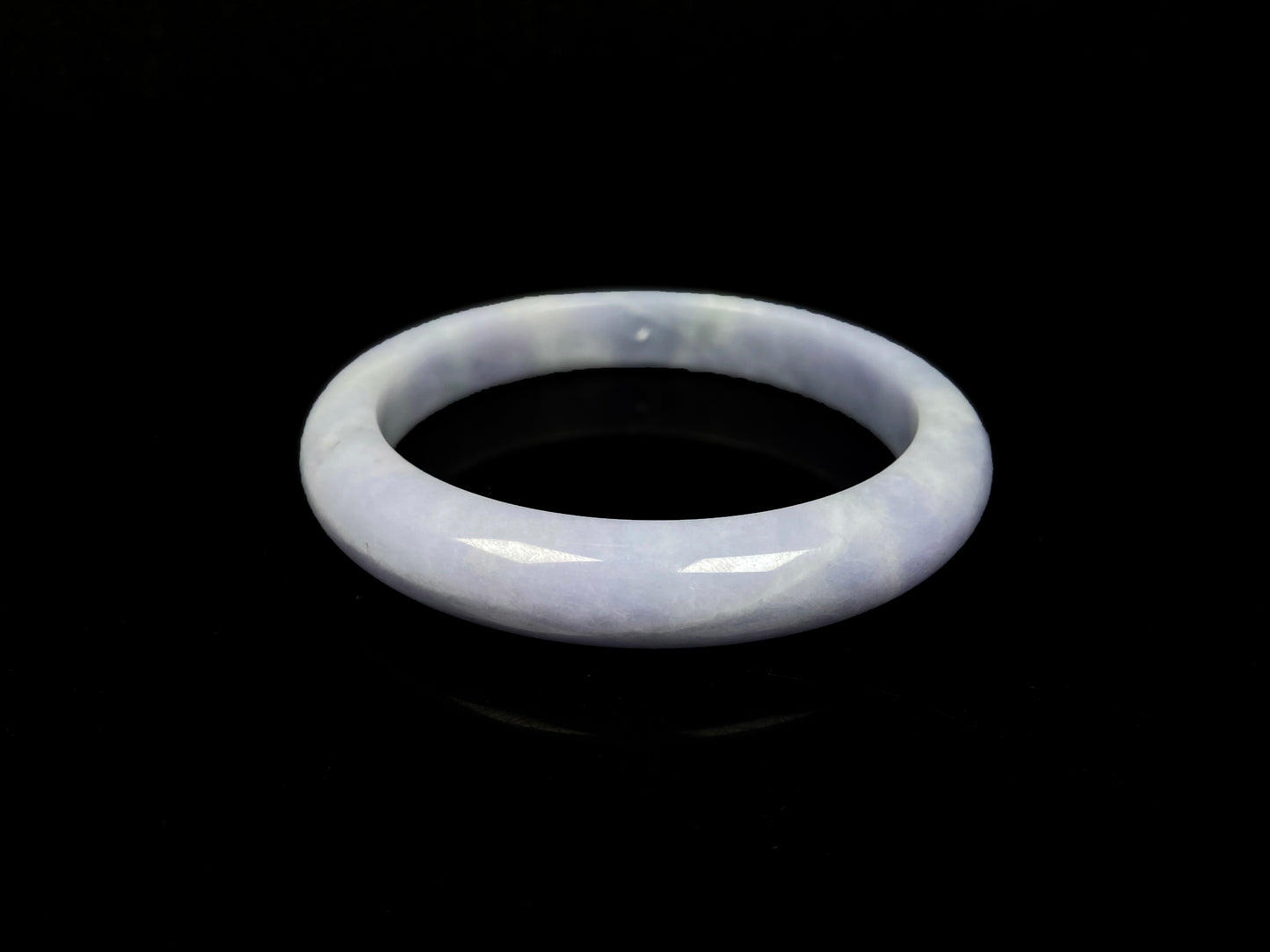 A soft lavender cloud jadeite bangle.