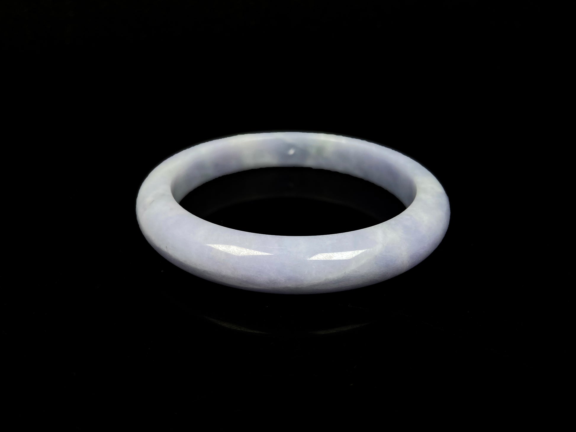 A soft lavender cloud jadeite bangle.