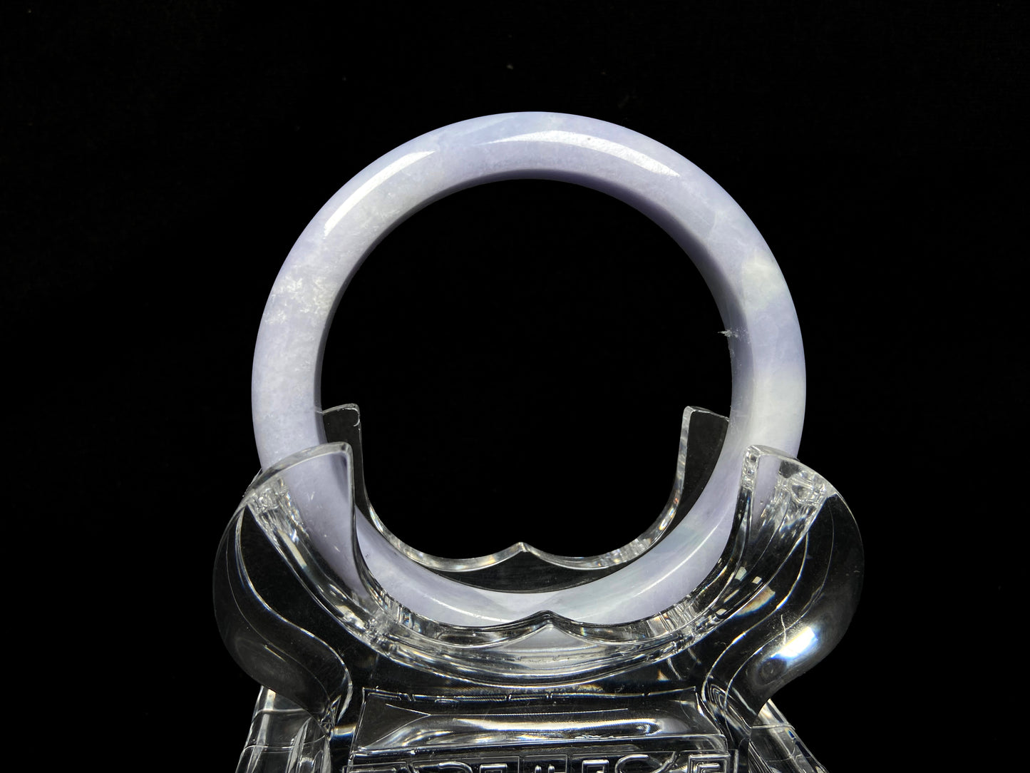 A soft lavender cloud jadeite bangle.