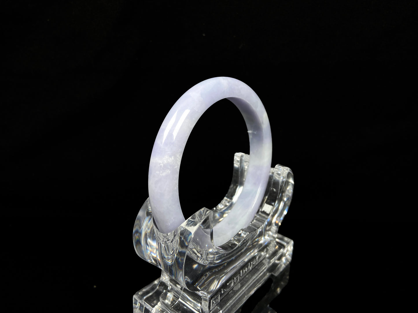 A soft lavender cloud jadeite bangle.