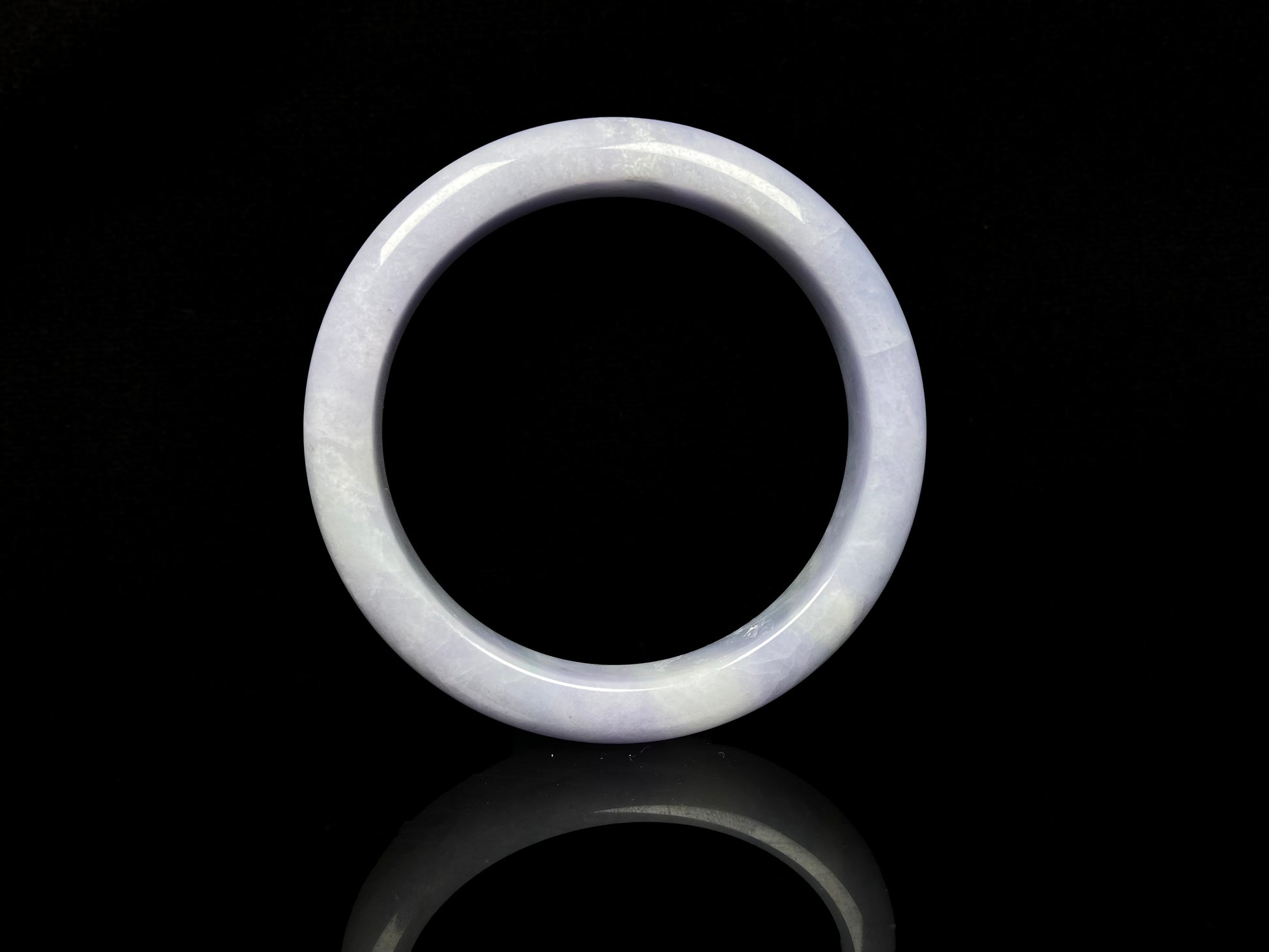 A soft lavender cloud jadeite bangle.