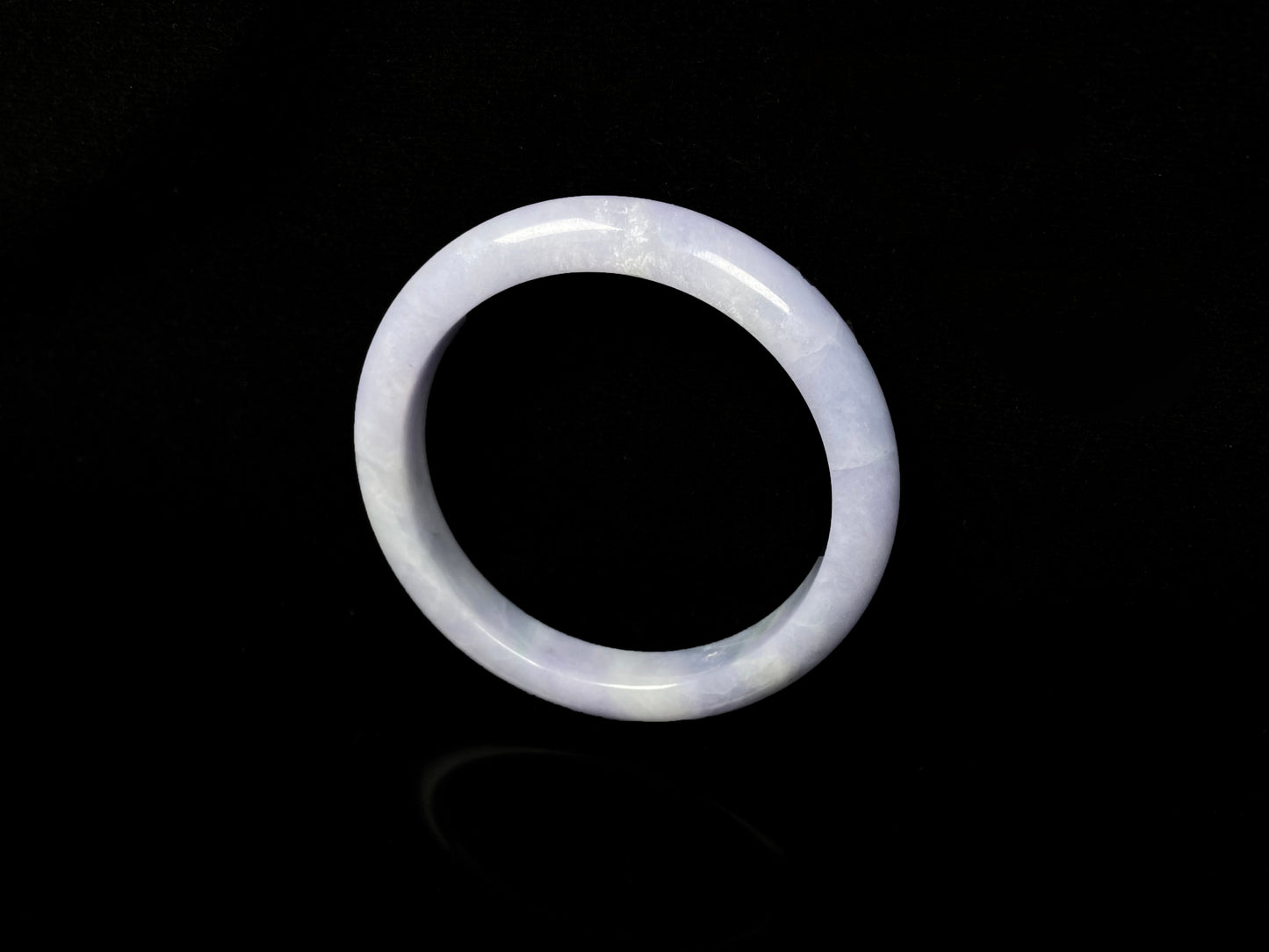 A soft lavender cloud jadeite bangle.