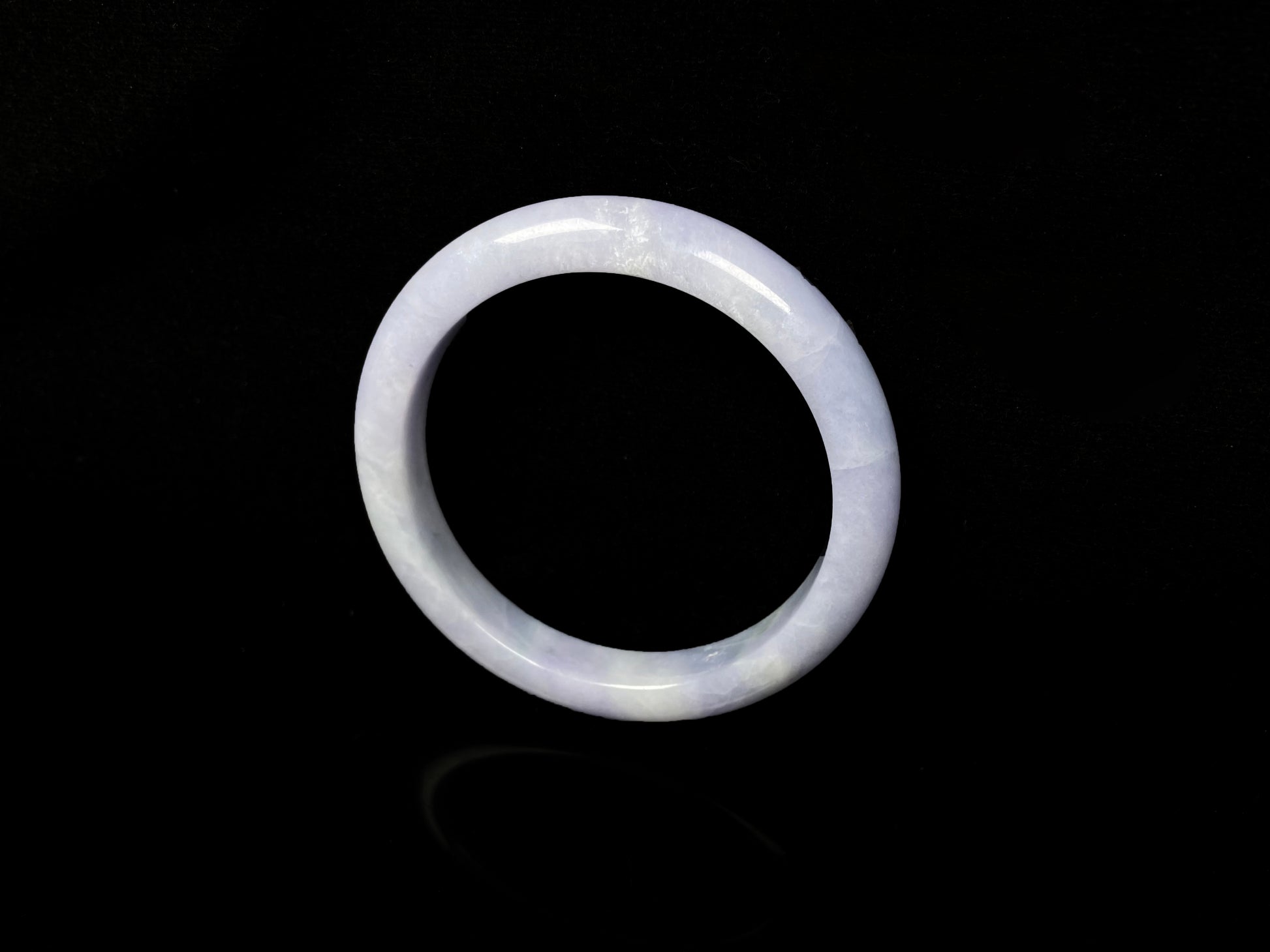 A soft lavender cloud jadeite bangle.