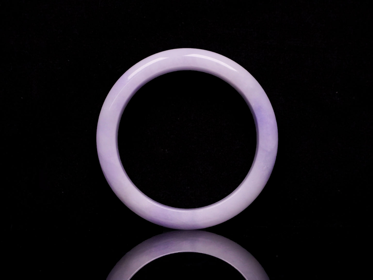 Lavender hues spreading jadeite bangle.