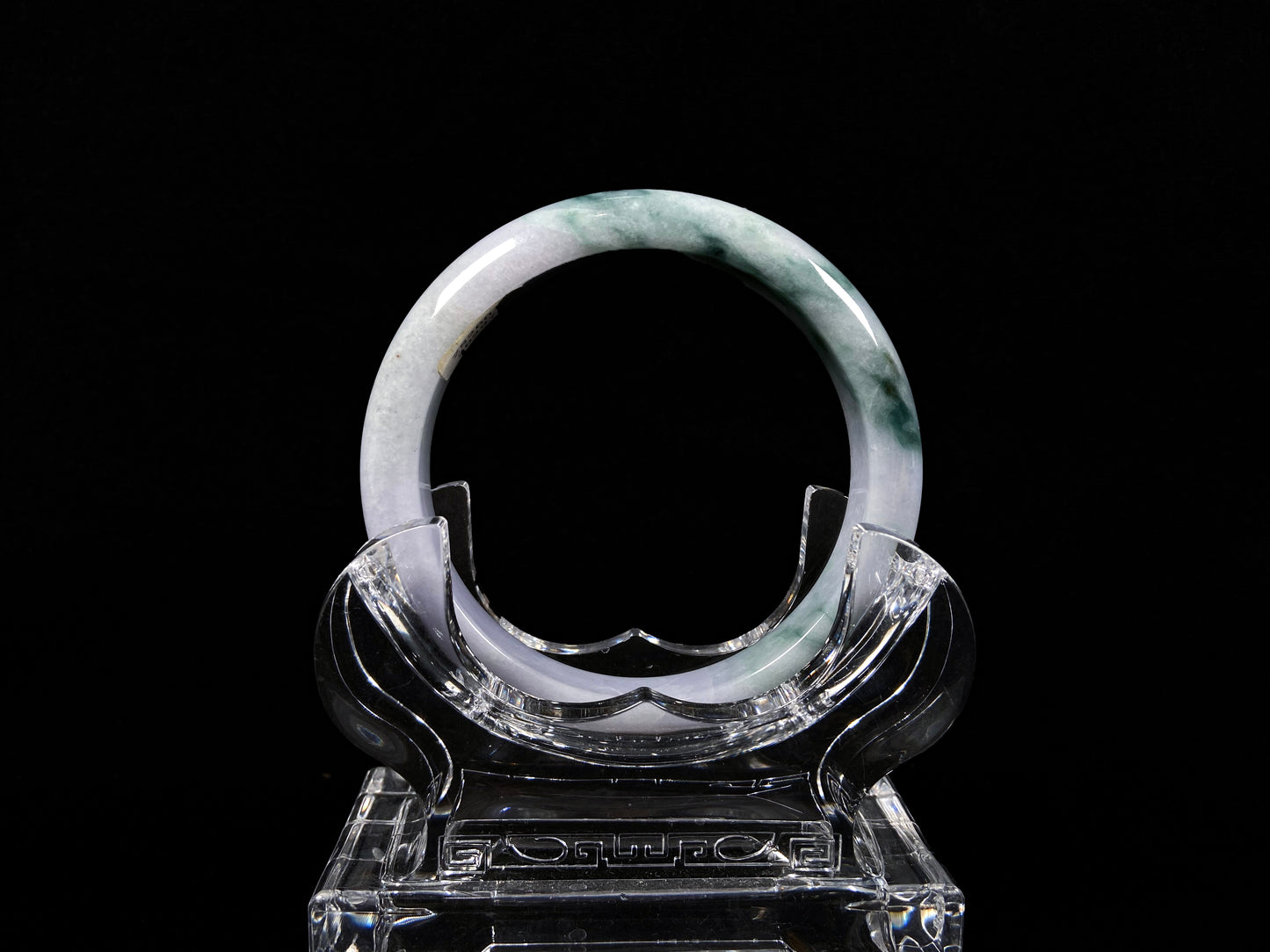 A lavender green mist jadeite bangle.