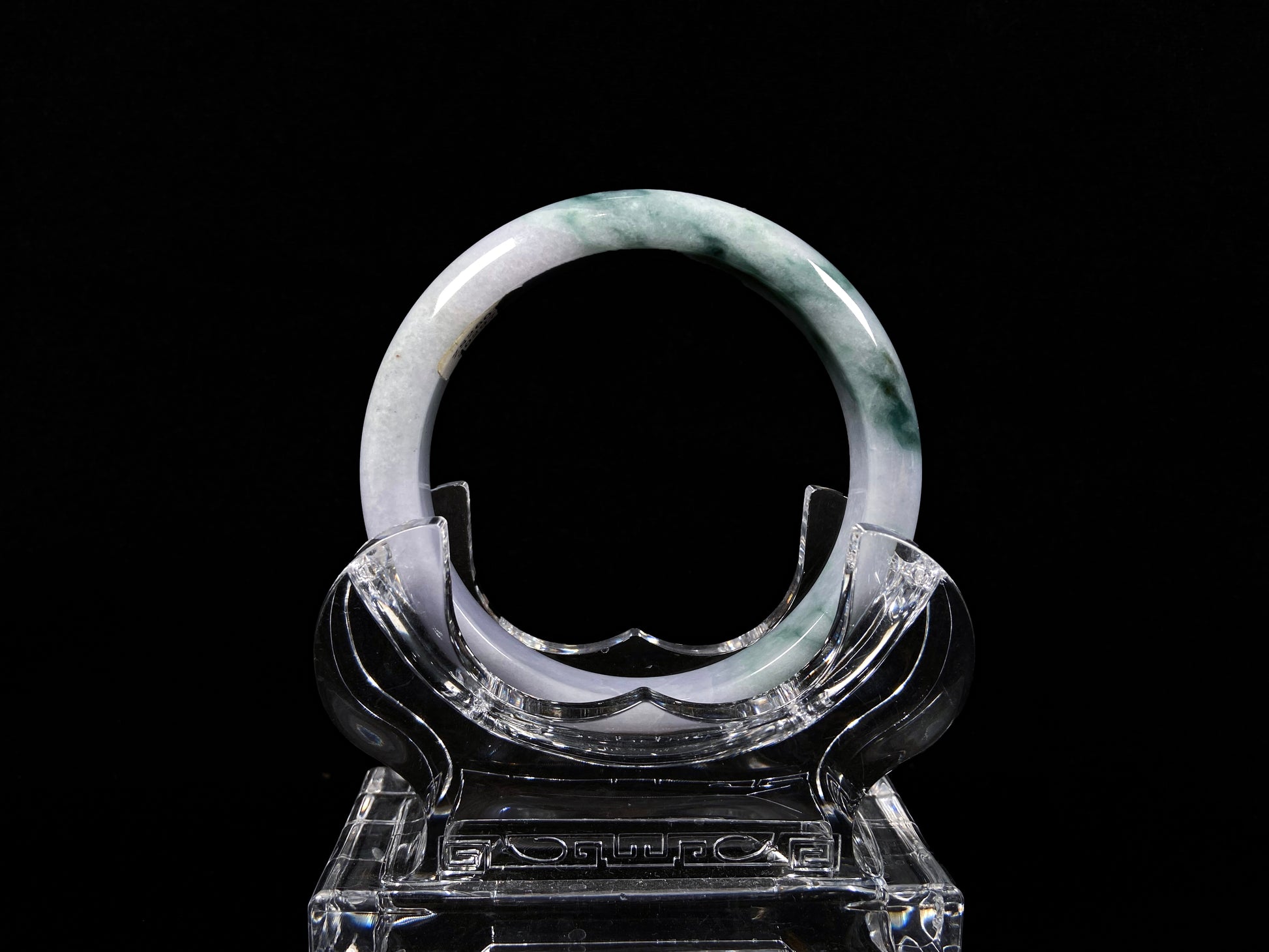 A lavender green mist jadeite bangle.