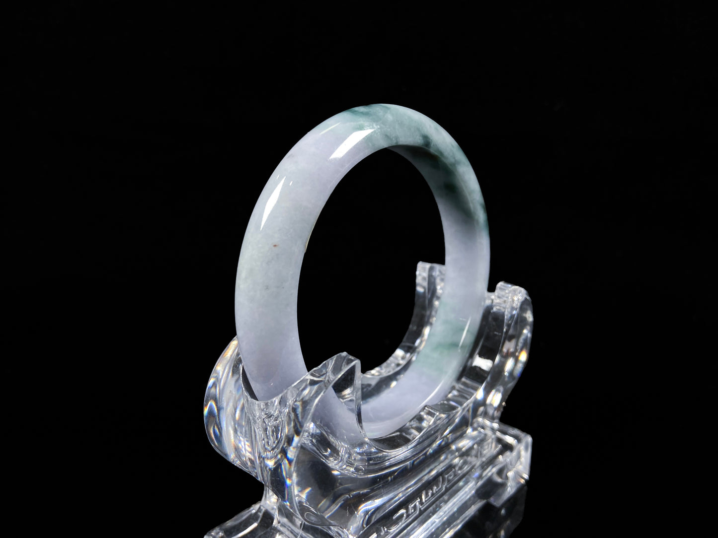 A lavender green mist jadeite bangle.