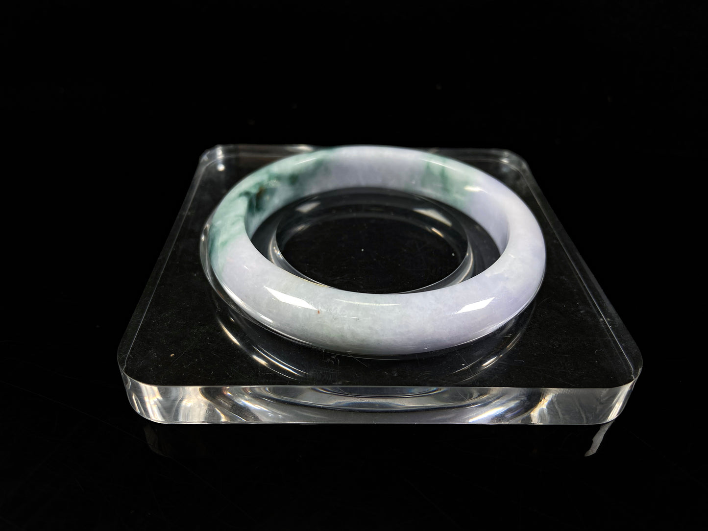 A lavender green mist jadeite bangle.