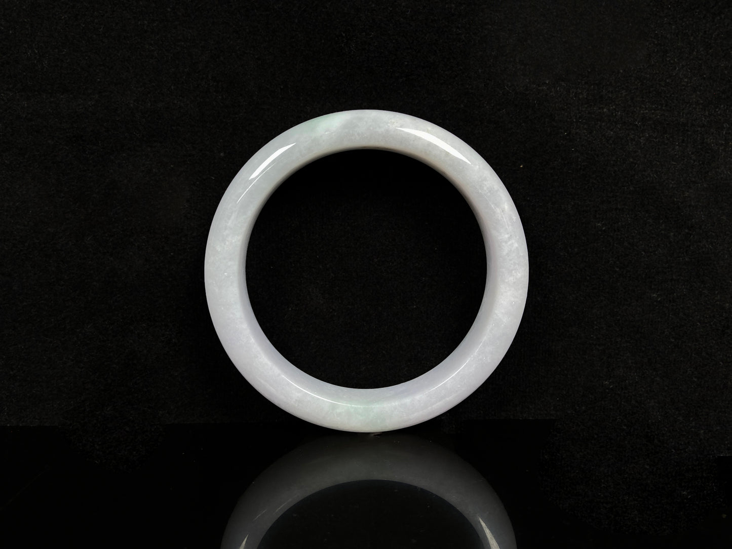 A violet white jadeite bangle.