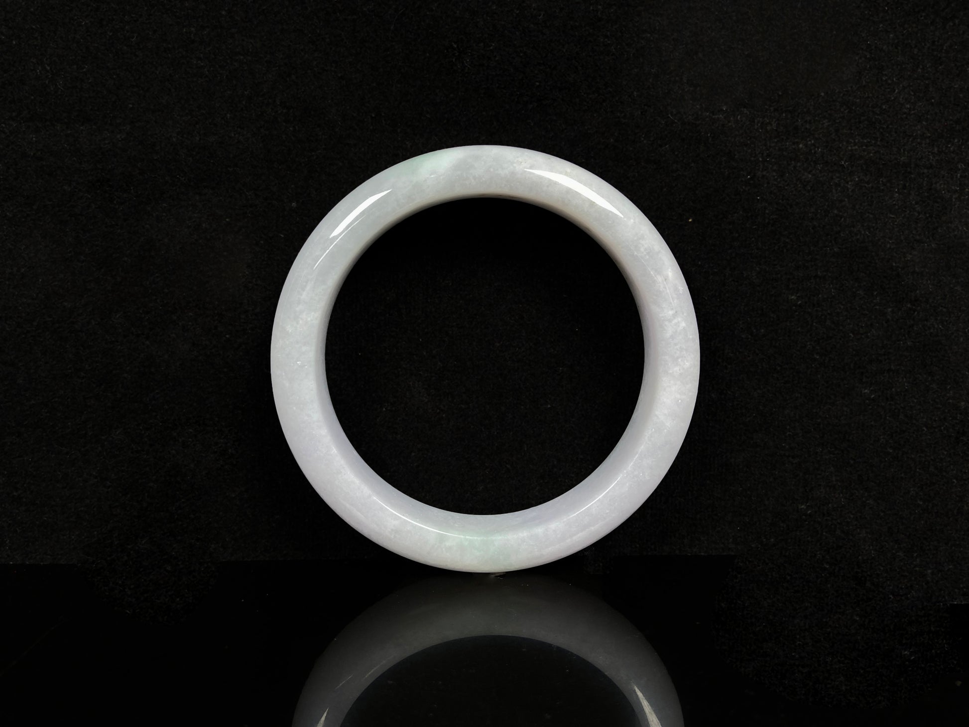 A violet white jadeite bangle.